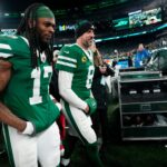 New York Jets wide receiver Davante Adams (17) and New York Jets quarterback Aaron Rodgers (8) are shown as they get ready to step off the field at MetLife Stadium, Sunday January 5, 2025, in East Rutherford.