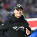 Jan 19, 2025; Orchard Park, New York, USA; Baltimore Ravens head coach John Harbaugh takes the field before the game against the Buffalo Bills in a 2025 AFC divisional round game at Highmark Stadium. Mandatory Credit: Mark Konezny-Imagn Images