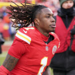 Jan 18, 2025; Kansas City, Missouri, USA; Kansas City Chiefs wide receiver Xavier Worthy (1) reacts before a 2025 AFC divisional round game against the Houston Texans at GEHA Field at Arrowhead Stadium.