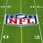 Feb 1, 2025; Orlando, FL, USA; An overall view of the NFL shield logo at midfield on the Camping World Stadium flag football field.