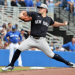 Feb 22, 2025; Dunedin, Florida, USA; New York Yankees pitcher Carlos Rodon (55) throws a pitch against the Toronto Blue Jays during the first inning at TD Ballpark. Mandatory Credit: Kim Klement Neitzel-Imagn Images