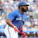 Feb 22, 2025; Dunedin, Florida, USA; Toronto Blue Jays first base Vladimir Guerrero Jr. (27) hits an RBI single against the New York Yankees during the first inning at TD Ballpark. Mandatory Credit: Kim Klement Neitzel-Imagn Images