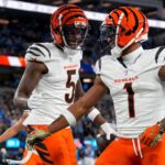 Cincinnati Bengals wide receivers Tee Higgins (5) and Ja'Marr Chase (1) celebrate a touchdown during a game on Nov. 17, 2024.
