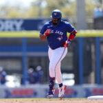 Feb 28, 2025; Dunedin, Florida, USA; Toronto Blue Jays first baseman Vladimir Guerrero Jr. (27) runs the bases after hitting a home run against the Detroit Tigers in the first inning during spring training at TD Ballpark.