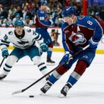 Mar 6, 2025; Denver, Colorado, USA; Colorado Avalanche defenseman Cale Makar (8) controls the puck ahead of San Jose Sharks left wing William Eklund (72) in the first period at Ball Arena. Mandatory Credit: Isaiah J. Downing-Imagn Images