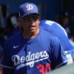 Mar 8, 2025; Phoenix, Arizona, USA; Los Angeles Dodgers manager Dave Roberts (30) gets ready against the Chicago White Sox before a game at Camelback Ranch-Glendale. Mandatory Credit: Rick Scuteri-Imagn Images
