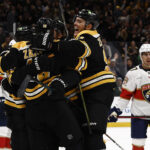 Mar 11, 2025; Boston, Massachusetts, USA; Boston Bruins defenseman Nikita Zadorov (91) joins the celebration after center Pavel Zacha (18) scored the go ahead goal as Florida Panthers center Evan Rodrigues (17) looks away during the third period at TD Garden. Mandatory Credit: Winslow Townson-Imagn Images