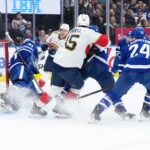 Mar 13, 2025; Toronto, Ontario, CAN; Florida Panthers center Anton Lundell (15) battles for the puck in front of Toronto Maple Leafs goaltender Anthony Stolarz (41) during the second period at Scotiabank Arena. Mandatory Credit: Nick Turchiaro-Imagn Images