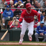 Mar 14, 2025; Tempe, Arizona, USA; Los Angeles Angels outfielder Mickey Moniak (8) hits a single again st the Kansas City Royals in the first inning at Tempe Diablo Stadium. Mandatory Credit: Rick Scuteri-Imagn Images