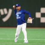 Mar 15, 2025; Bunkyo, Tokyo, Japan; Los Angeles Dodgers shortstop Mookie Betts (50) warms up before the game against the Yomiuri Giants at Tokyo Dome. Mandatory Credit: Darren Yamashita-Imagn Images
