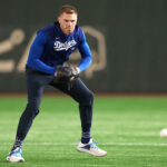 Mar 15, 2025; Bunkyo, Tokyo, Japan; Los Angeles Dodgers first baseman Freddie Freeman (5) warms up before the game against the Yomiuri Giants at Tokyo Dome. Mandatory Credit: Darren Yamashita-Imagn Images