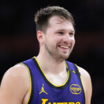 Mar 17, 2025; Los Angeles, California, USA; Los Angeles Lakers guard Luka Doncic (77) reacts against the San Antonio Spurs in the first half at Crypto.com Arena.
