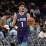 Mar 20, 2025; Charlotte, North Carolina, USA; Charlotte Hornets guard LaMelo Ball (1) brings the ball up court against the New York Knicks during the second half at Spectrum Center.