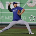 Mar 24, 2025; Anaheim, California, USA; Los Angeles Dodgers two-way player Shohei Ohtani (17) throws in the outfield prior to the game against the Los Angeles Angels at Angel Stadium. Mandatory Credit: Jayne Kamin-Oncea-Imagn Images