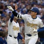 Mar 27, 2025; Los Angeles, California, USA; Los Angeles Dodgers two-way player Shohei Ohtani (17) reacts after hitting a solo home run against the Detroit Tigers during the seventh inning at Dodger Stadium. Mandatory Credit: Jayne Kamin-Oncea-Imagn Images