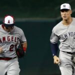 Jul 17, 2018; Washington, DC, USA; American League outfielder Aaron Judge of the New York Yankees (99) and American League outfielder Mike Trout of the Los Angeles Angels (27) run to the dug out after the first inning in the 2018 MLB All Star Game at Nationals Ballpark. Mandatory Credit: Geoff Burke-USA TODAY Sports