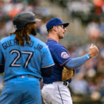Jun 4, 2023; New York City, New York, USA; New York Mets first baseman Pete Alonso (20) reacts after a video replay reversal calls out Toronto Blue Jays first baseman Vladimir Guerrero Jr. (27) during the first inning at Citi Field. Mandatory Credit: John Jones-USA TODAY Sports