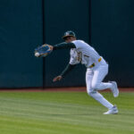 May 6, 2024; Oakland, California, USA; Oakland Athletics outfielder Esteury Ruiz (1) fields a fly ball during the sixth inning against the Texas Rangers at Oakland-Alameda County Coliseum. Mandatory Credit: Neville E. Guard-USA TODAY Sports