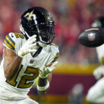 Oct 7, 2024; Kansas City, Missouri, USA; New Orleans Saints wide receiver Chris Olave (12) catches a pass during the second half against the Kansas City Chiefs at GEHA Field at Arrowhead Stadium. Mandatory Credit: Jay Biggerstaff-Imagn Images