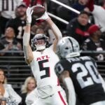 Dec 16, 2024; Paradise, Nevada, USA; Atlanta Falcons wide receiver Drake London (5) catches the ball against Las Vegas Raiders safety Isaiah Pola-Mao (20) in the first half at Allegiant Stadium. Mandatory Credit: Kirby Lee-Imagn Images