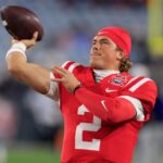 Jaxson Dart NFL Draft - (EDITORÕS NOTE: Resubmitted with alternate crop.) Mississippi Rebels quarterback Jaxson Dart (2) warms up before the TaxSlayer Gator Bowl Thursday, Jan. 2, 2025 at EverBank Stadium in Jacksonville, Fla. [Corey Perrine/Florida Times-Union]