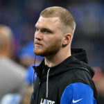 Jan 18, 2025; Detroit, Michigan, USA; Detroit Lions defensive lineman Aidan Hutchinson (97) looks on from the bench during the fourth quarter against the Washington Commanders in a 2025 NFC divisional round game at Ford Field. Mandatory Credit: Lon Horwedel-Imagn Images