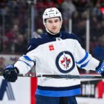 Jan 28, 2025; Montreal, Quebec, CAN; Winnipeg Jets defenseman Neal Pionk (4) looks on against the Montreal Canadiens during the third period at Bell Centre. Mandatory Credit: David Kirouac-Imagn Images