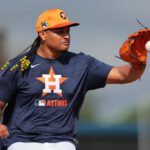 Feb 14, 2025; West Palm Beach, FL, USA; Houston Astros starting pitcher Luis Garcia (77) works on a fielding exercise during a spring training workout at CACTI Park of the Palm Beaches. Mandatory Credit: Sam Navarro-Imagn Images