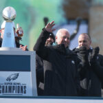 Feb 14, 2025; Philadelphia, PA, USA; Philadelphia Eagles owner Jeffrey Lurie waves to the crowd next to the Vince Lombardi Trophy during the Super Bowl LIX championship parade and rally. Mandatory Credit: Kirby Lee-Imagn Images