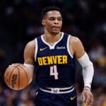 Russell Westbrook - Mar 14, 2025; Denver, Colorado, USA; Denver Nuggets guard Russell Westbrook (4) controls the ball in the first quarter against the Los Angeles Lakers at Ball Arena.