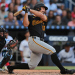 Mar 27, 2025; Miami, Florida, USA; Pittsburgh Pirates left fielder Bryan Reynolds (10) hits a two-run single against the Miami Marlins during the fifth inning at loanDepot Park. Mandatory Credit: Sam Navarro-Imagn Images