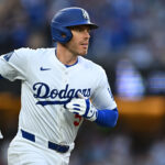 Mar 29, 2025; Los Angeles, California, USA; Los Angeles Dodgers first baseman Freddie Freeman (5) hits a home run during the 1st inning against the Detroit Tigers at Dodger Stadium. Mandatory Credit: Jonathan Hui-Imagn Images