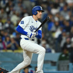 Mar 29, 2025; Los Angeles, California, USA; Los Angeles Dodgers first baseman Freddie Freeman (5) hits a double in the seventh inning against the Detroit Tigers at Dodger Stadium. Mandatory Credit: Jonathan Hui-Imagn Images