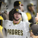 Apr 1, 2025; San Diego, California, USA; San Diego Padres center fielder Jackson Merrill (3) is congratulated after hitting a solo home run during the fourth inning against the Cleveland Guardians at Petco Park. Mandatory Credit: Denis Poroy-Imagn Images