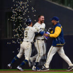 Apr 2, 2025; Milwaukee, Wisconsin, USA; Milwaukee Brewers second baseman Brice Turang (2) celebrates a walkoff win after driving in the winning run in the eleventh inning against the Kansas City Royals at American Family Field. Mandatory Credit: Benny Sieu-Imagn Images
