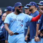 Apr 4, 2025; New York City, New York, USA; Toronto Blue Jays first baseman Vladimir Guerrero Jr. (27) is introduced before the New York Mets home opener at Citi Field. Mandatory Credit: Brad Penner-Imagn Images