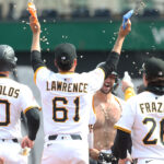 Apr 9, 2025; Pittsburgh, Pennsylvania, USA; Pittsburgh Pirates teammates celebrate with catcher Joey Bart (shirtless) after Bart hit a game winning walk off single to defeat the St. Louis Cardinals in the thirteenth inning at PNC Park. Mandatory Credit: Charles LeClaire-Imagn Images