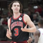 Apr 9, 2025; Chicago, Illinois, USA; Chicago Bulls guard Josh Giddey (3) reacts after making a three point basket against the Miami Heat during the second half at United Center.