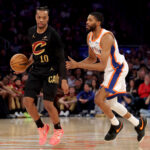 Apr 11, 2025; New York, New York, USA; Cleveland Cavaliers guard Darius Garland (10) controls the ball against New York Knicks forward Mikal Bridges (25) during the first quarter at Madison Square Garden.