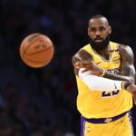 Apr 11, 2025; Los Angeles, California, USA; Los Angeles Lakers forward LeBron James (23) passes against the Houston Rockets during the first half at Crypto.com Arena.