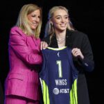 Apr 14, 2025; New York, New York, USA; Paige Bueckers poses with WNBA commissioner Cathy Engelbert after being selected with the number one overall pick to the Dallas Wings in the 2025 WNBA Draft at The Shed at Hudson Yards.