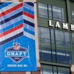 A banner advertising the 2025 NFL Draft on display in the parking lot of Lambeau Field on April 11, 2025, in Green Bay, Wis. NFL Draft 2025