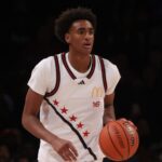 Apr 1, 2025; Brooklyn, NY, USA; McDonald's All American West guard Alijah Arenas (16) dribbles the ball during the first half of the game McDonald's All American East at Barclays Center. NBA