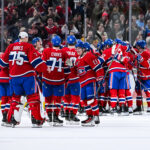 Apr 16, 2025; Montreal, Quebec, CAN; Montreal Canadiens players gather to celebrate their win against the Carolina Hurricanes in the third period at Bell Centre. Mandatory Credit: David Kirouac-Imagn Images