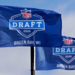 Flags promoting the 2025 NFL Draft pictured on April 19, 2025, at Leicht Memorial Park in Green Bay, Wis.