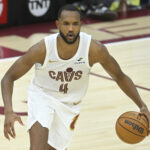 Apr 20, 2025; Cleveland, Ohio, USA; Cleveland Cavaliers forward Evan Mobley (4) dribbles the ball in the fourth quarter against the Miami Heat at Rocket Arena.