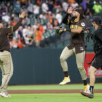 Apr 20, 2025; Houston, Texas, USA;San Diego Padres right fielder Fernando Tatis Jr. (23) and second baseman Jose Iglesias (7) celebrate defeating the Houston Astros at Daikin Park. Mandatory Credit: Thomas Shea-Imagn Images