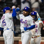 Apr 21, 2025; New York City, New York, USA; New York Mets shortstop Francisco Lindor (12) is greeted at home plate by outfielder Tyrone Taylor (15) after hitting a three run home run against the Philadelphia Phillies during the seventh inning at Citi Field. Mandatory Credit: John Jones-Imagn Images