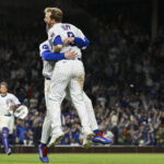 Apr 22, 2025; Chicago, Illinois, USA; Chicago Cubs outfielder Ian Happ (8) celebrates with outfielder Pete Crow-Armstrong (4) after he hits an RBI single against the Los Angeles Dodgers during the tenth inning at Wrigley Field. Mandatory Credit: Matt Marton-Imagn Images