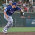 Apr 22, 2025; West Sacramento, California, USA; Texas Rangers shortstop Corey Seager (5) fields the ball during the second inning of the game against the Athletics at Sutter Health Park. Mandatory Credit: Ed Szczepanski-Imagn Images